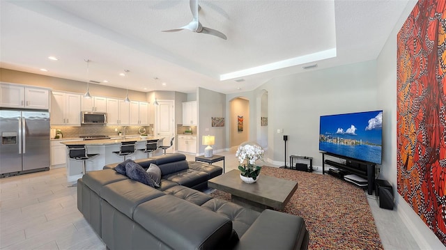 living room with ceiling fan