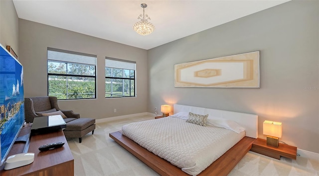 bedroom featuring light colored carpet