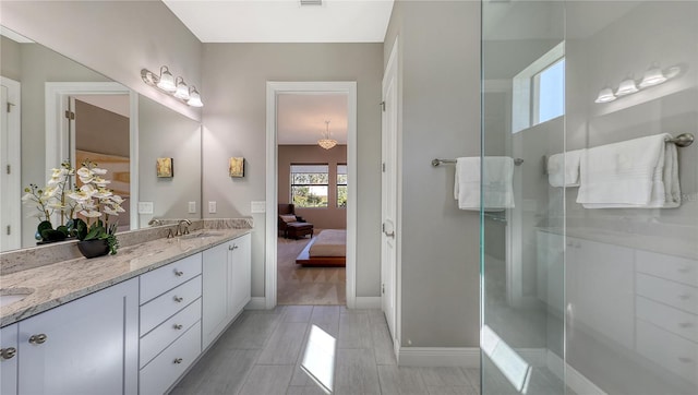 bathroom with vanity and an enclosed shower