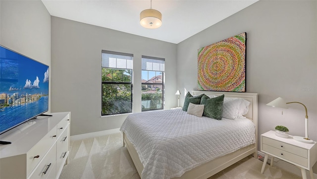 bedroom with light colored carpet