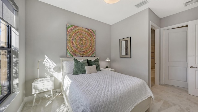 bedroom with light colored carpet