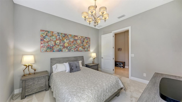 carpeted bedroom with a notable chandelier