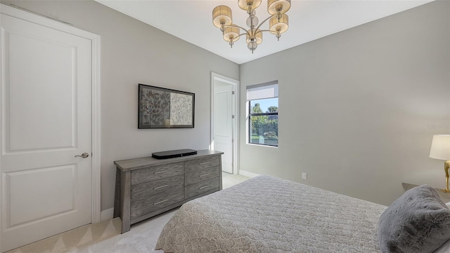 bedroom with light colored carpet and an inviting chandelier