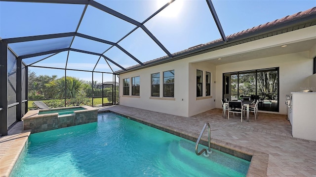 view of pool featuring a lanai, a patio area, and an in ground hot tub