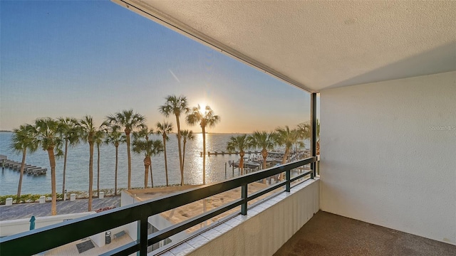 balcony at dusk with a water view