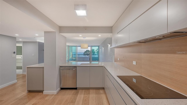 kitchen featuring black electric stovetop, white cabinets, light hardwood / wood-style flooring, dishwasher, and hanging light fixtures