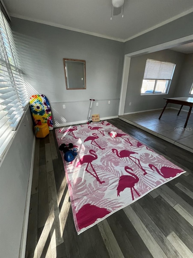 bedroom with crown molding and dark wood-type flooring