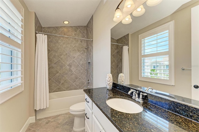 full bathroom with tile patterned flooring, vanity, shower / bath combo, and toilet