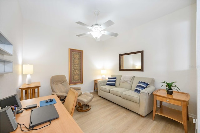 office area with light hardwood / wood-style flooring and ceiling fan