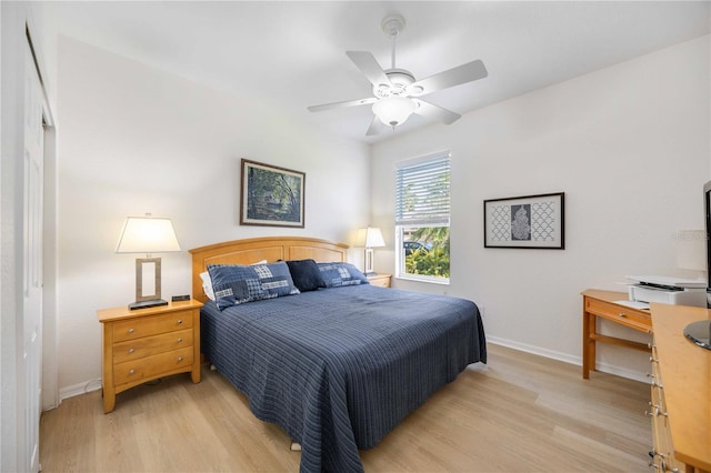 bedroom with light wood-type flooring and ceiling fan