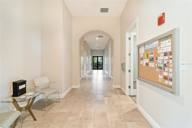 hallway featuring light tile patterned flooring