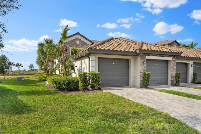 view of front of property with a garage and a front yard