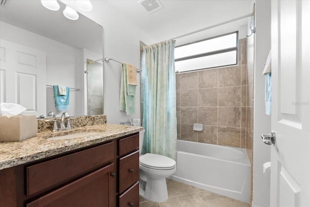 full bathroom featuring toilet, vanity, shower / tub combo, and tile patterned flooring