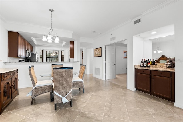 dining area featuring crown molding, a notable chandelier, and light tile patterned flooring