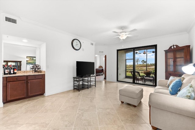 tiled living room featuring crown molding