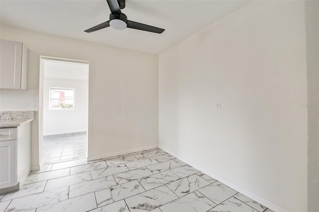 spare room with ceiling fan