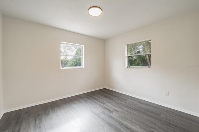 spare room featuring dark hardwood / wood-style flooring