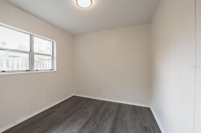 spare room featuring dark hardwood / wood-style floors