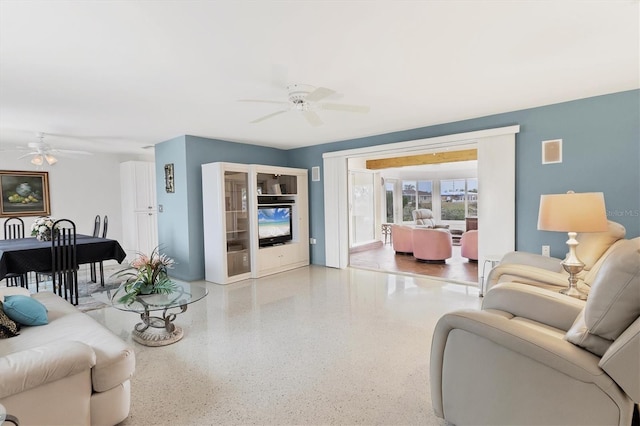 living room featuring ceiling fan