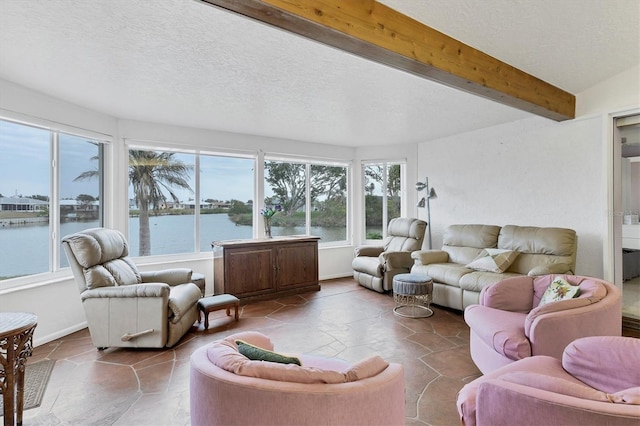 sunroom with a water view