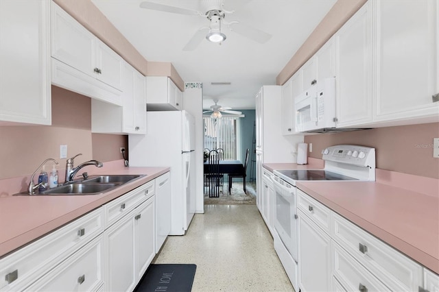 kitchen with white cabinetry, sink, ceiling fan, and white appliances