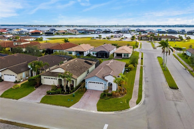 birds eye view of property featuring a water view