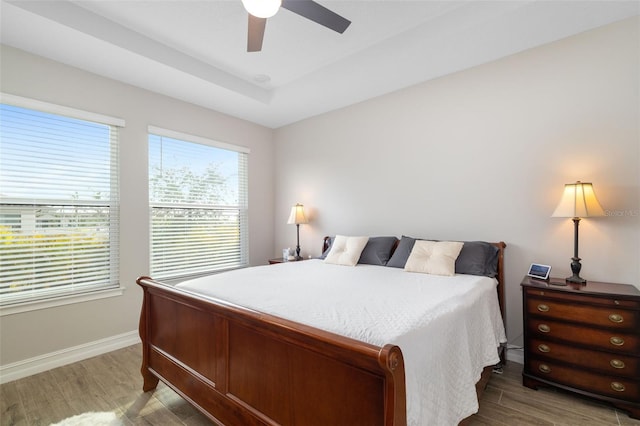 bedroom featuring wood-type flooring and ceiling fan