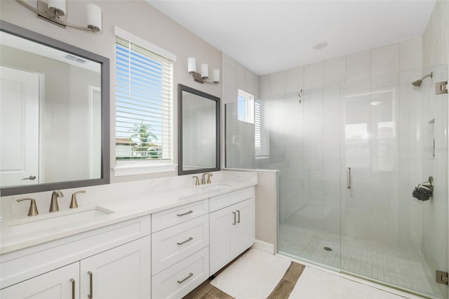 bathroom with vanity and an enclosed shower