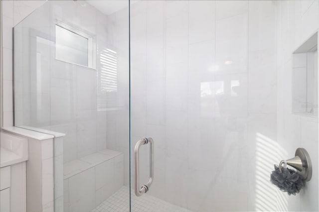 bathroom with a shower with shower door