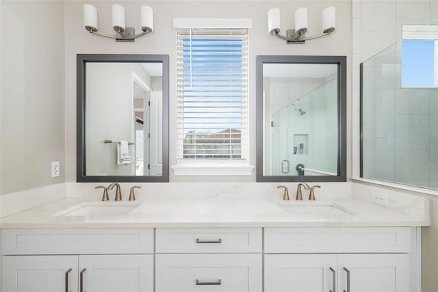 bathroom featuring vanity and an enclosed shower