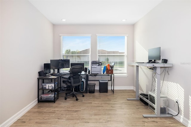 office space with light hardwood / wood-style floors