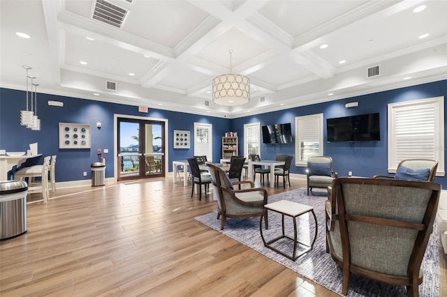 living room with beamed ceiling, light wood-type flooring, ornamental molding, and coffered ceiling