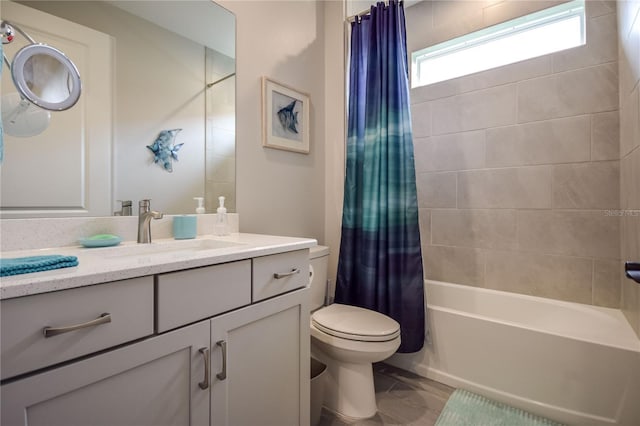 full bathroom with shower / tub combo, vanity, and toilet