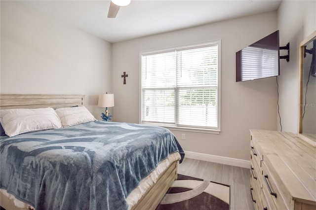 bedroom featuring ceiling fan and light wood-type flooring