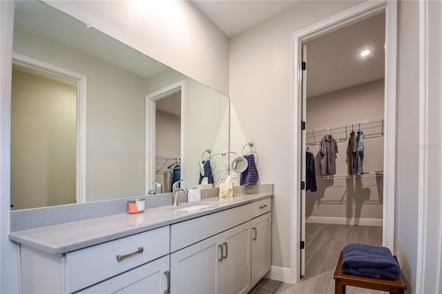 bathroom featuring vanity and hardwood / wood-style floors