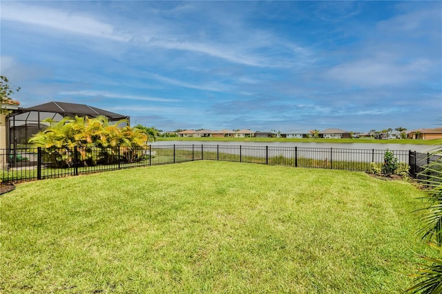 view of yard featuring glass enclosure