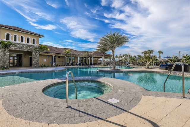 view of swimming pool featuring a hot tub and a gazebo