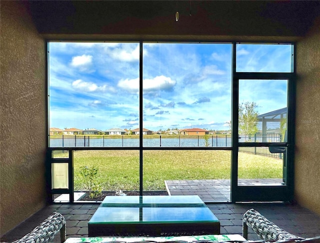 sunroom with a water view