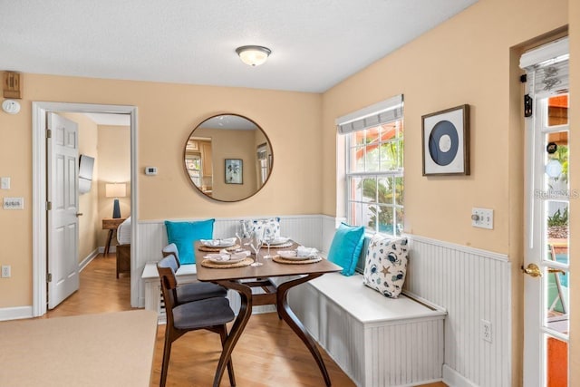 dining space featuring breakfast area and light hardwood / wood-style flooring