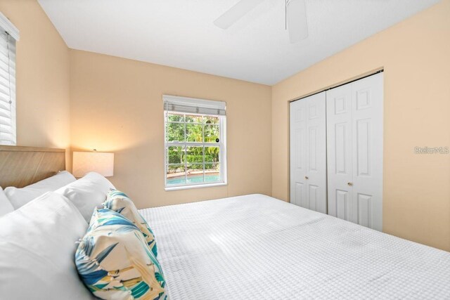 bedroom featuring a closet and ceiling fan