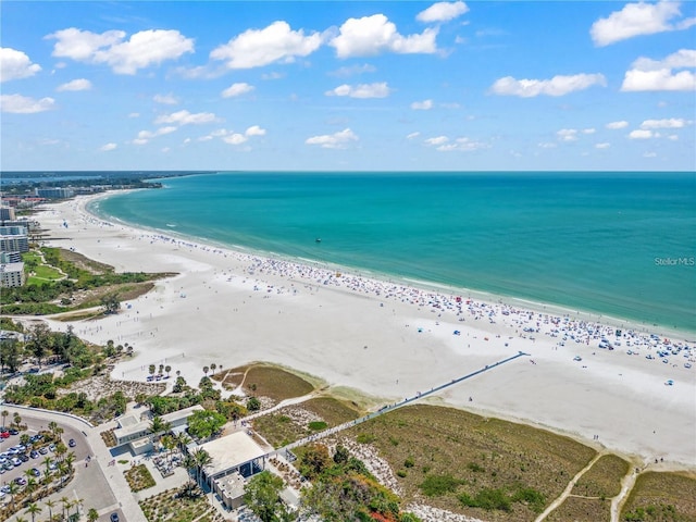 aerial view with a water view and a beach view