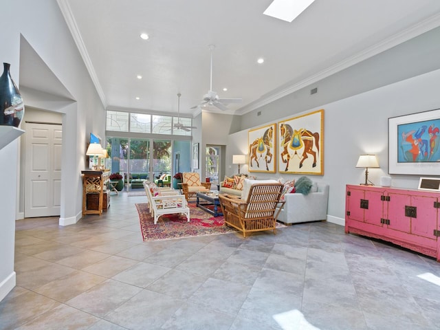 living room with ceiling fan and ornamental molding