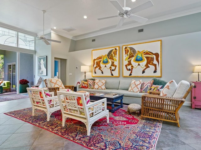 living room featuring tile patterned flooring, crown molding, and a high ceiling