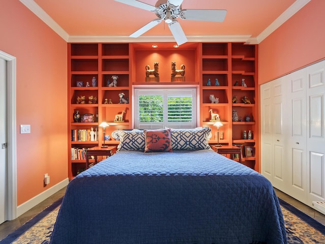 tiled bedroom featuring a closet, ceiling fan, and crown molding