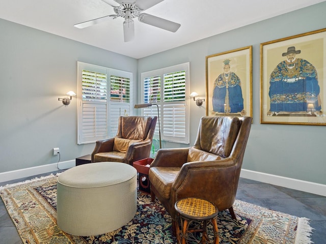 living area featuring ceiling fan