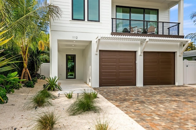 view of front of house with a balcony and a garage