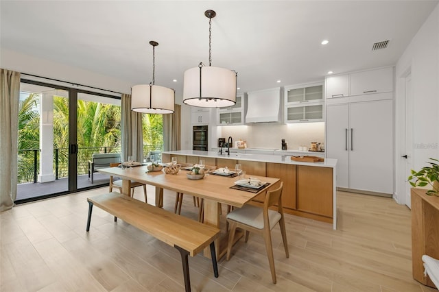 dining room with light wood-type flooring