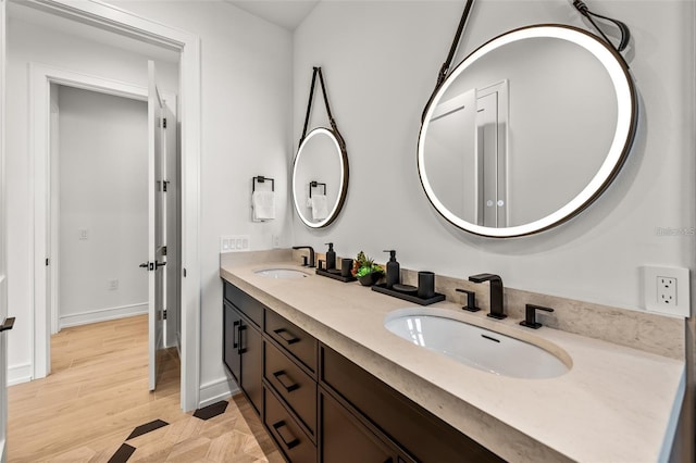 bathroom with vanity and wood-type flooring