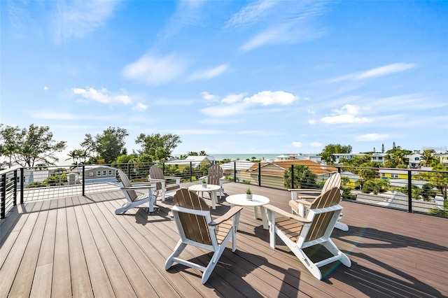 wooden terrace featuring a water view