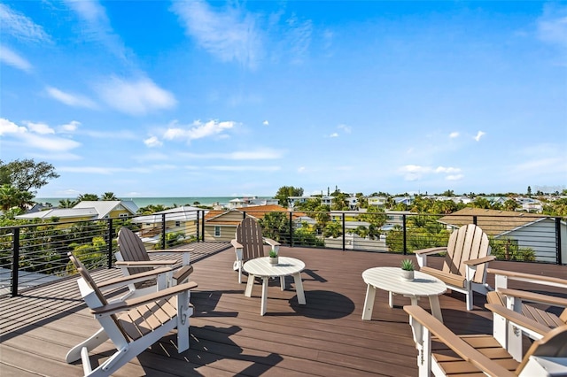 wooden deck featuring a water view